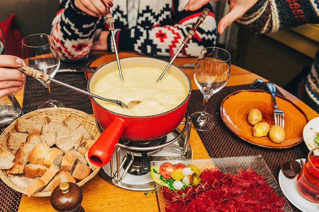 https://www.smartertravel.com/uploads/2020/03/cheese-fondue-table-cut-bread.jpg